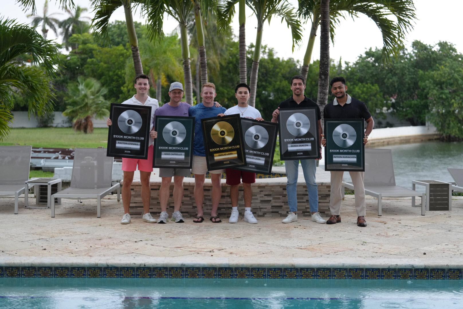 Level Up REI clients receiving $100K Month Club awards